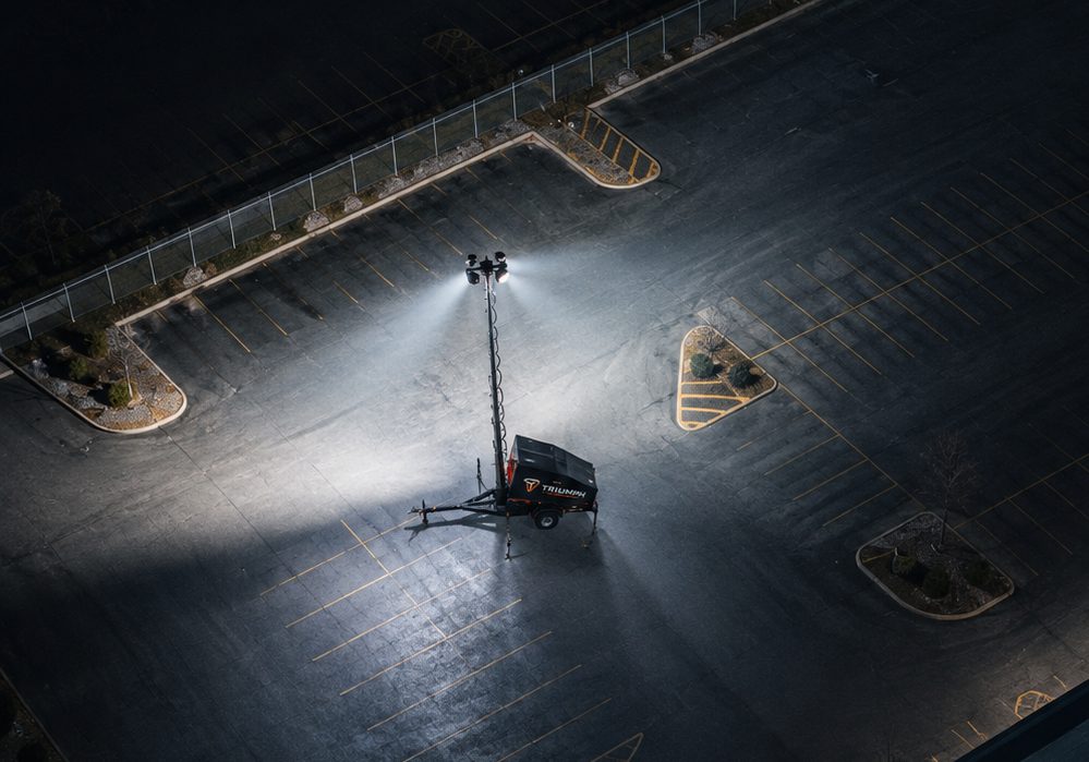 Watchtower unit lighting up a parking lot at night